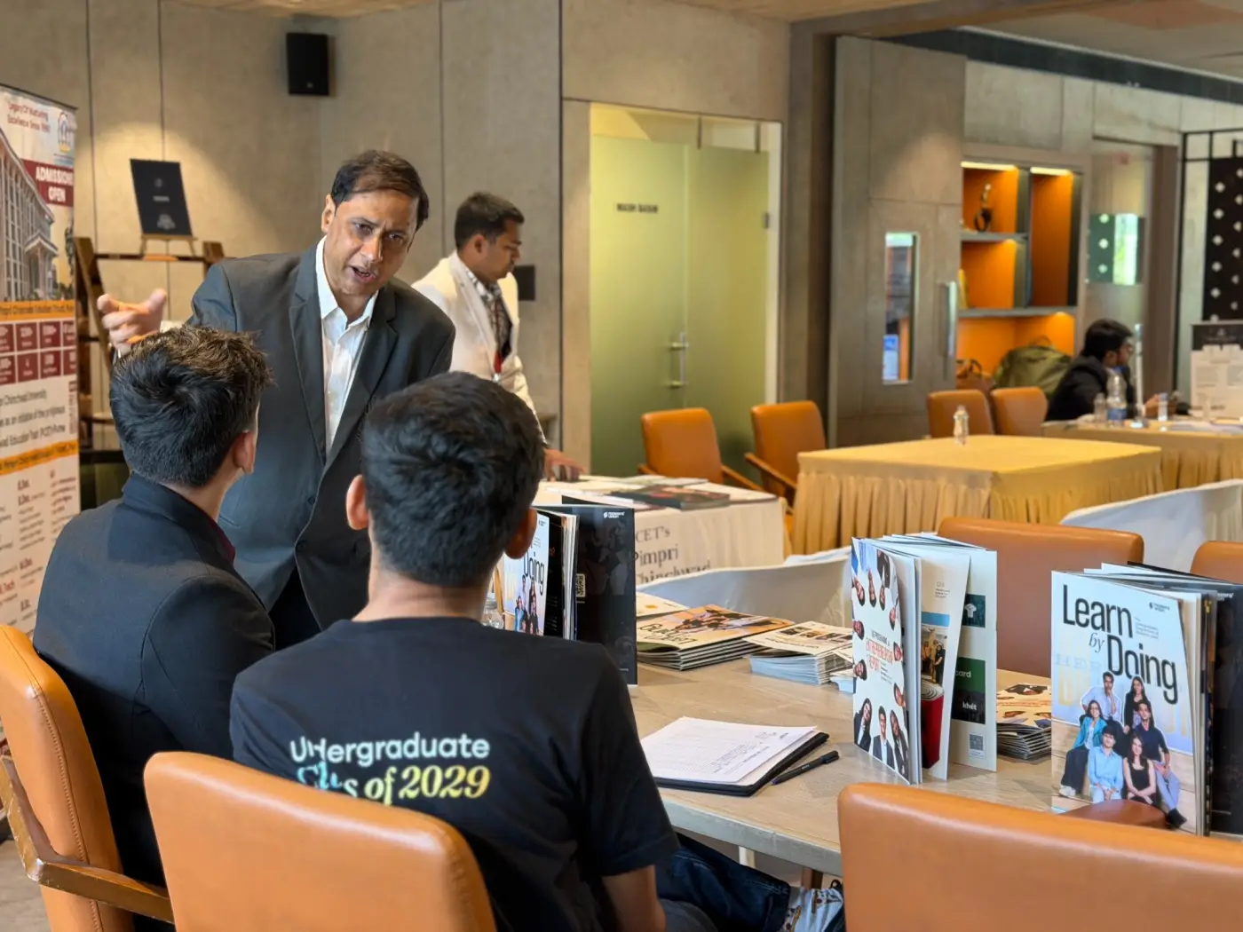 A counsellor speaking with event attendees