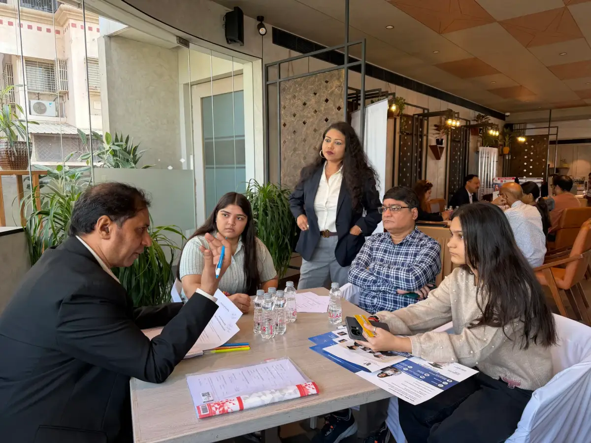 A group discussing materials at a workshop